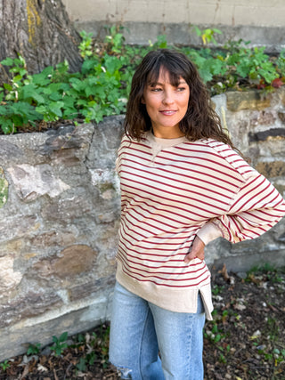 Dropped shoulder cream sweater with rust stripes