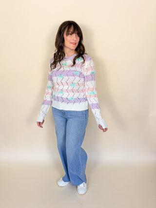 Pastel stripe sweater with floral embroidery and crochet knit texture

 