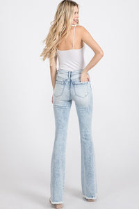 Distressed Mid-Rise Petite Flare Jeans with Frayed Hem